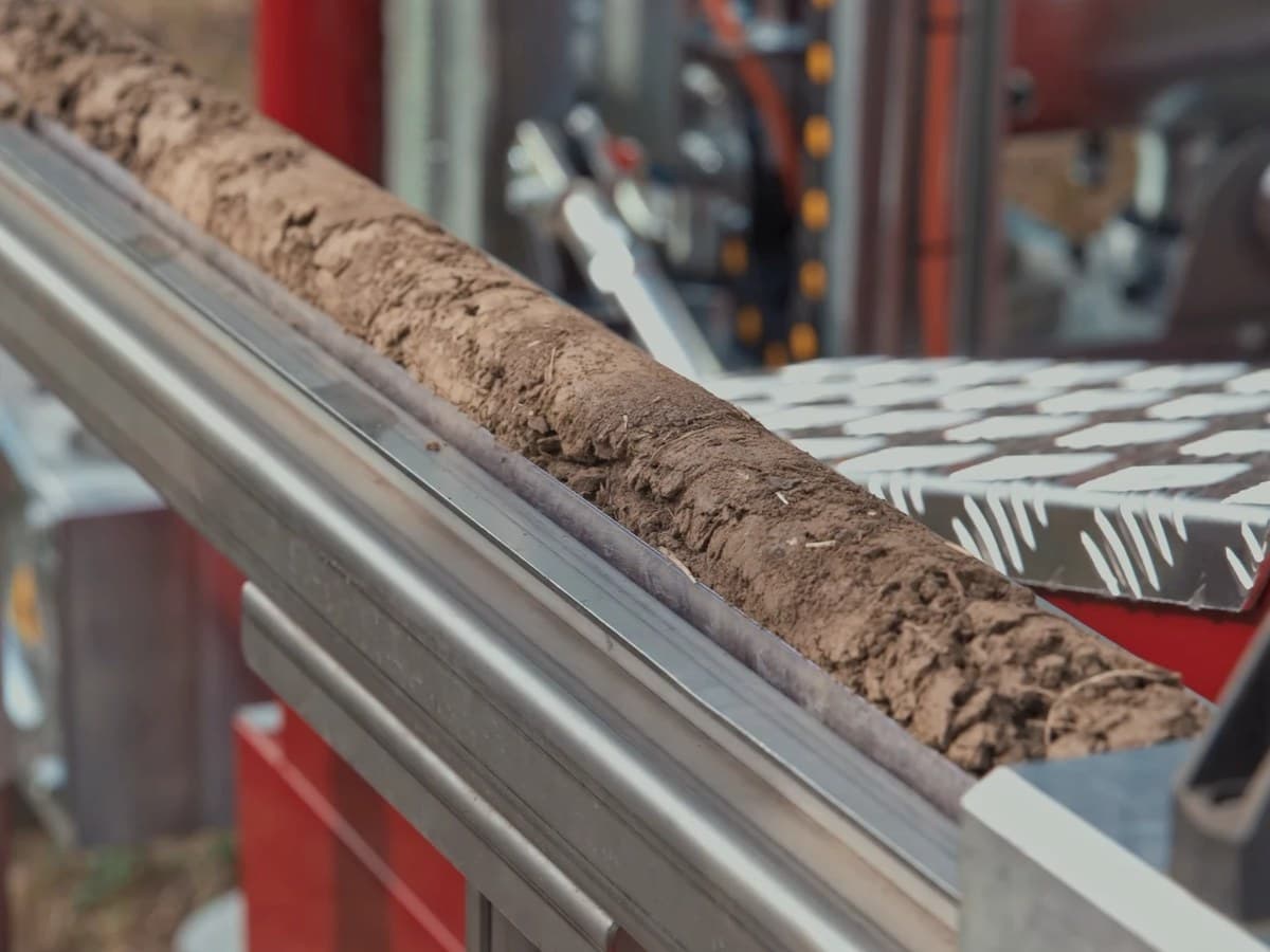Soil core recovered with a DS-44 sampler laid out on the CPT rig