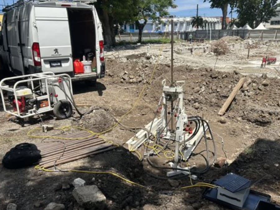 GID CPT rig, support van and rod stack set up on the demolition site alongside the annex building footprint