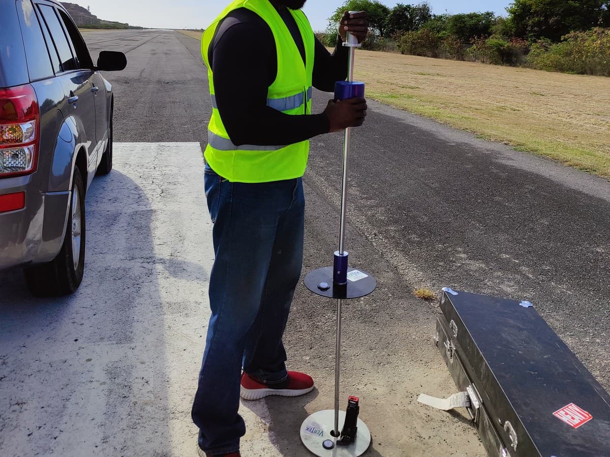 GID field technician operating the Smart DCP on an airport runway